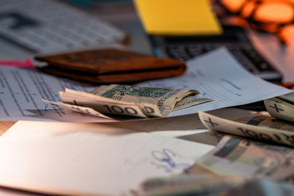 Foreign currency and financial paperwork on a desk